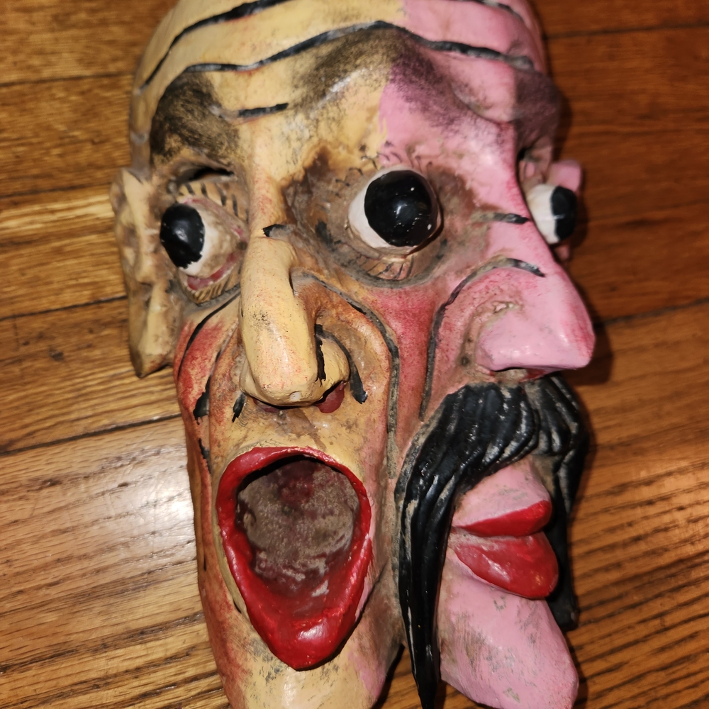 Vibrant Dual-Face Art Sculpture in Red and Pink